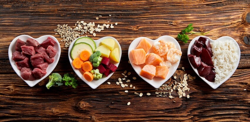 food in heart shaped bowls